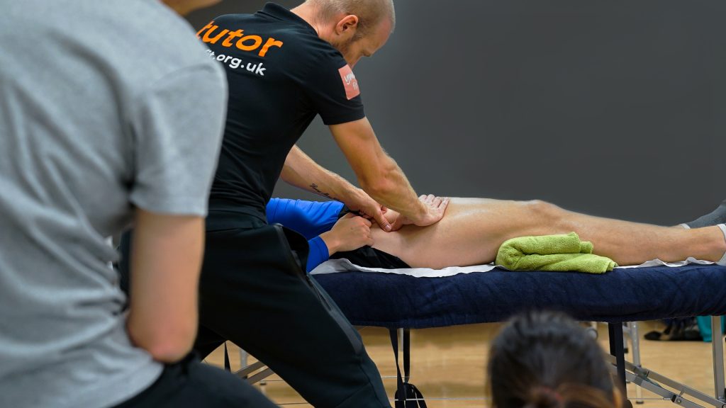 male massaging a leg