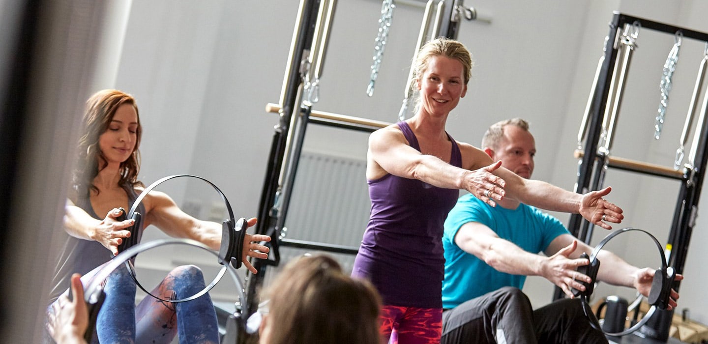 Women on reformers in a STOTT PILATES advanced class at YMCA KX