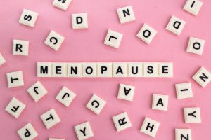 a group of white letters on a pink background