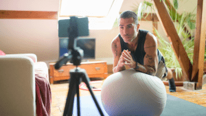 fitness professional live streaming a workout at home