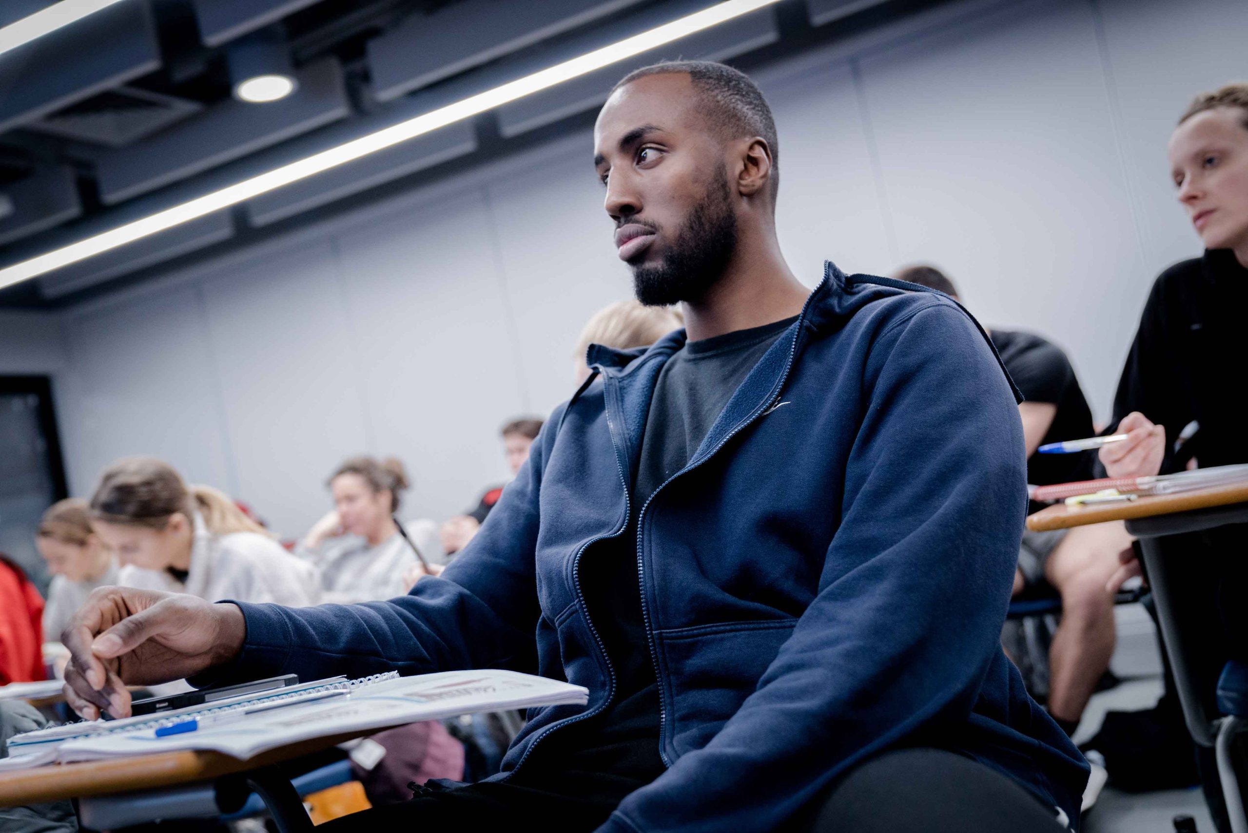 Student attentively listening in class.