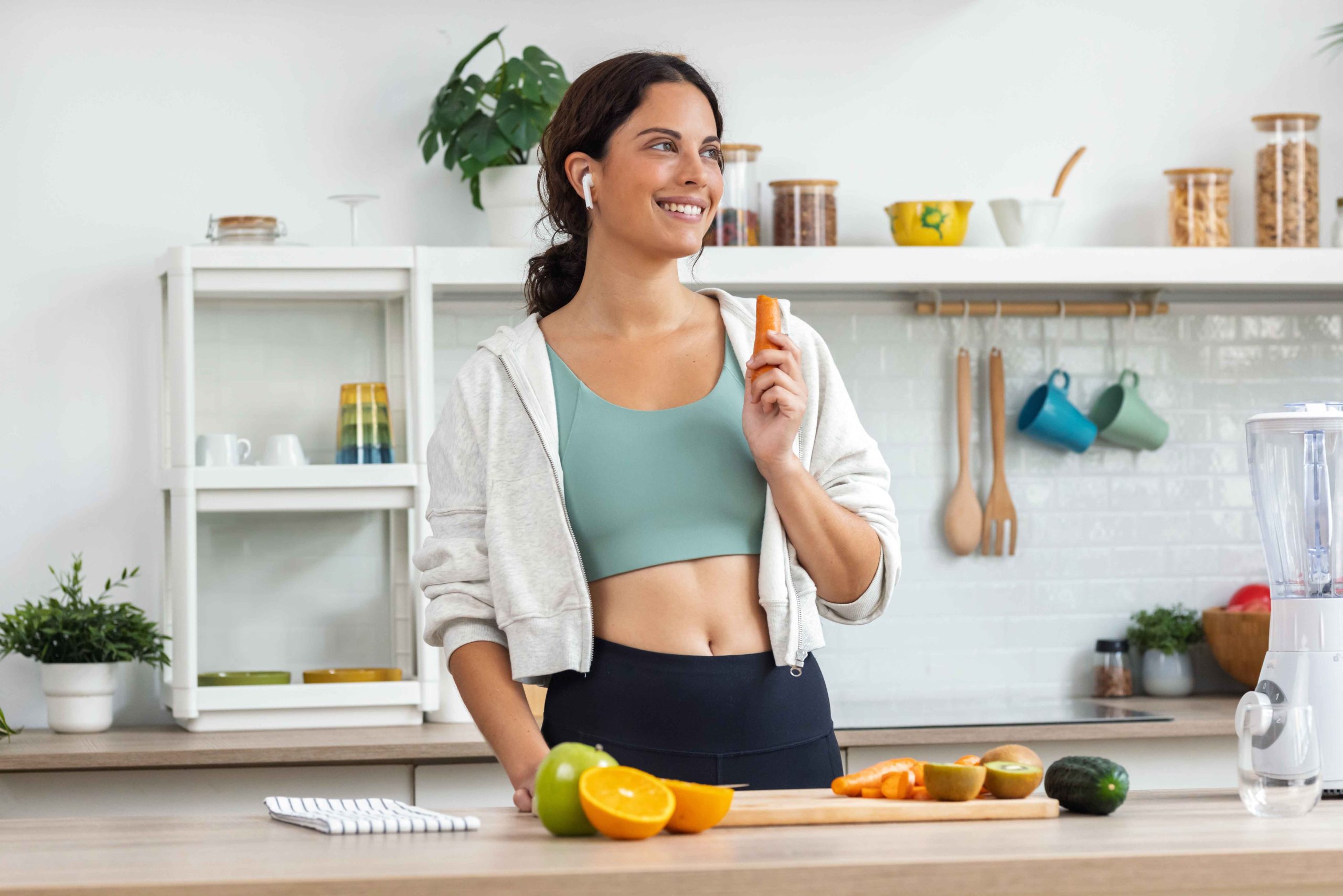 Smiling woman preparing healthy snacks
